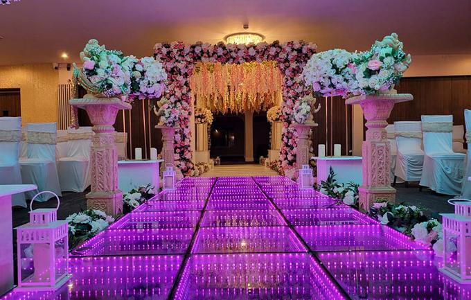 Wedding isle set up with lighting and flowers