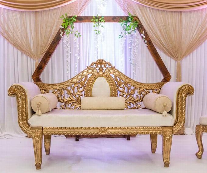 gold and white roll top gilded sofa