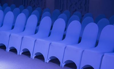 Covered chairs in rows in venu
