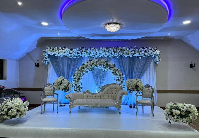Modern blue up lighting at wedding venue